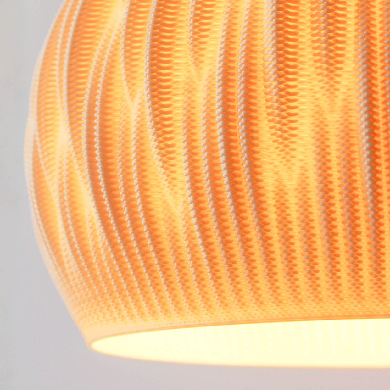 
                  
                    Detail of how light passes through the translucent Flax 3D Printed Lamp Lights. Made from biodegradable composite material with flax fibers
                  
                