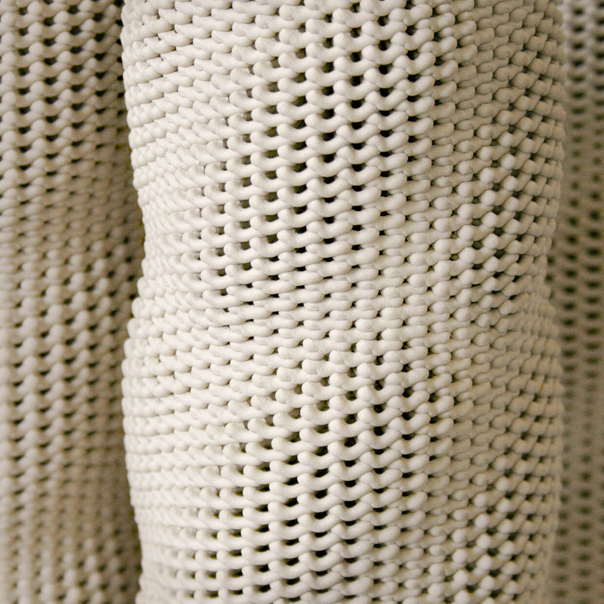 
                  
                    Close-up of multiple Kilim 3D printed ceramic vases by Drag And Drop, emphasizing the woven texture inspired by textiles
                  
                