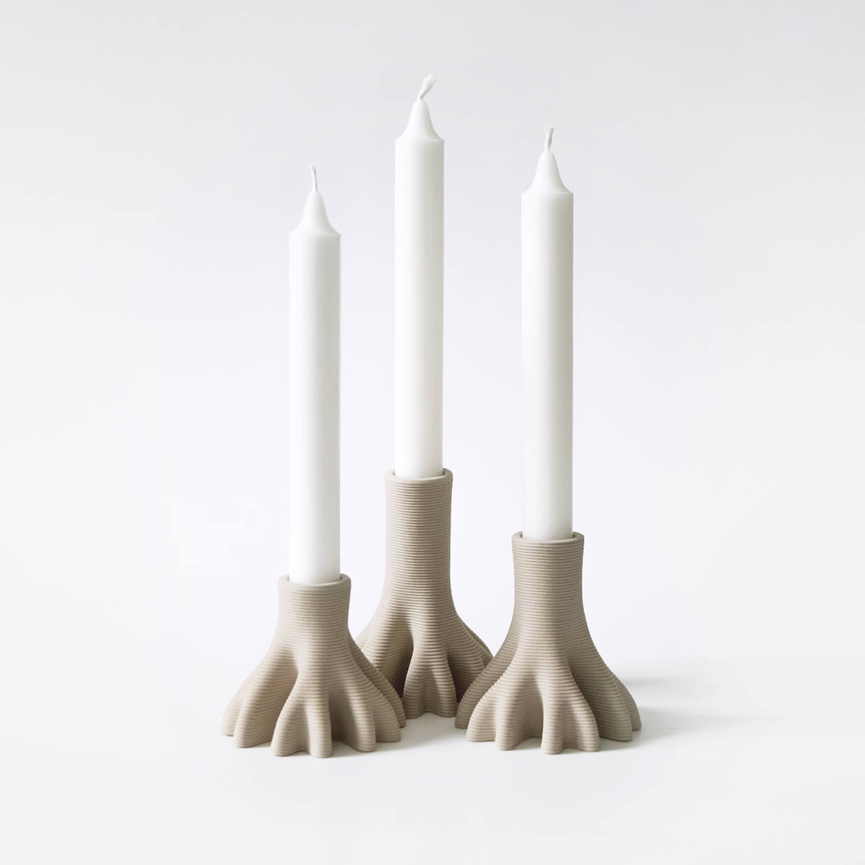 
                  
                    Set of 3 3D Printed Ceramic Candleholders holding candles
                  
                
