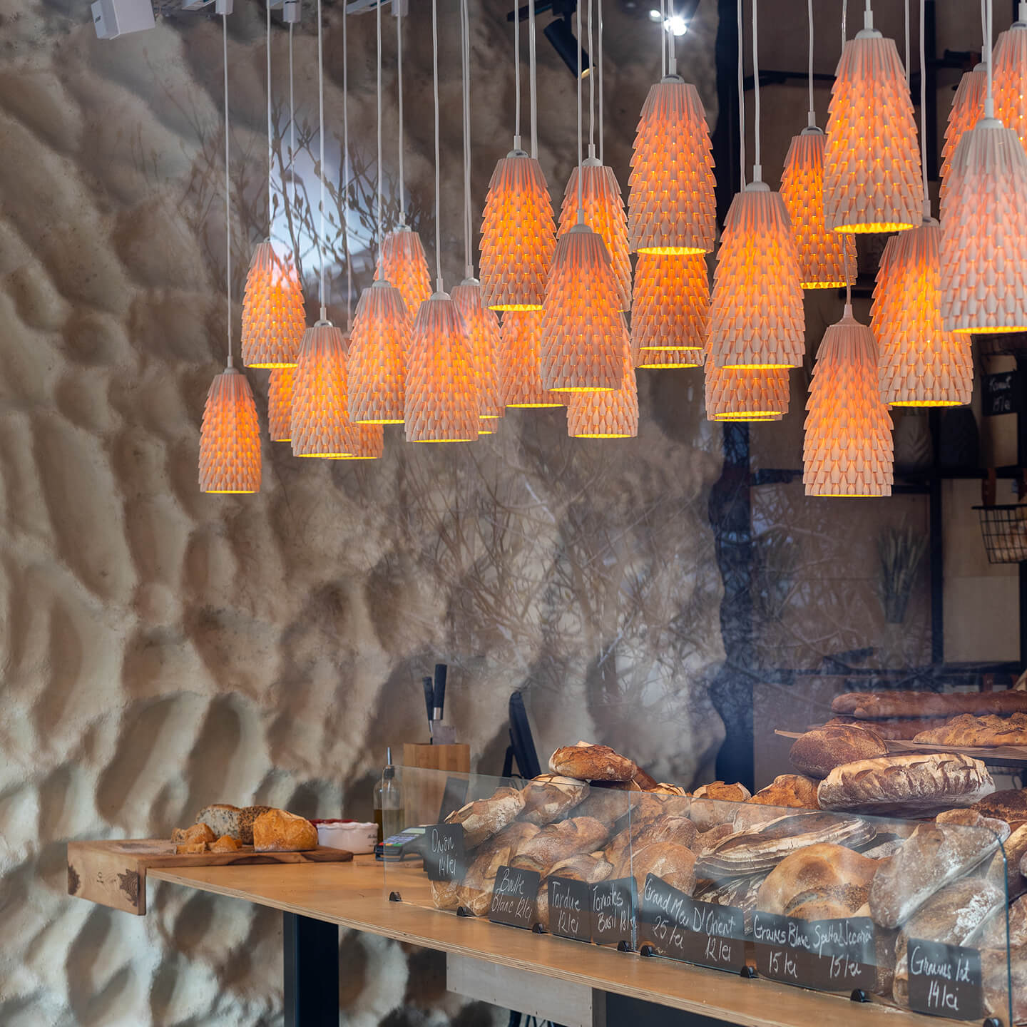 A cluster of 33 Armadillo Lamps in a bakery