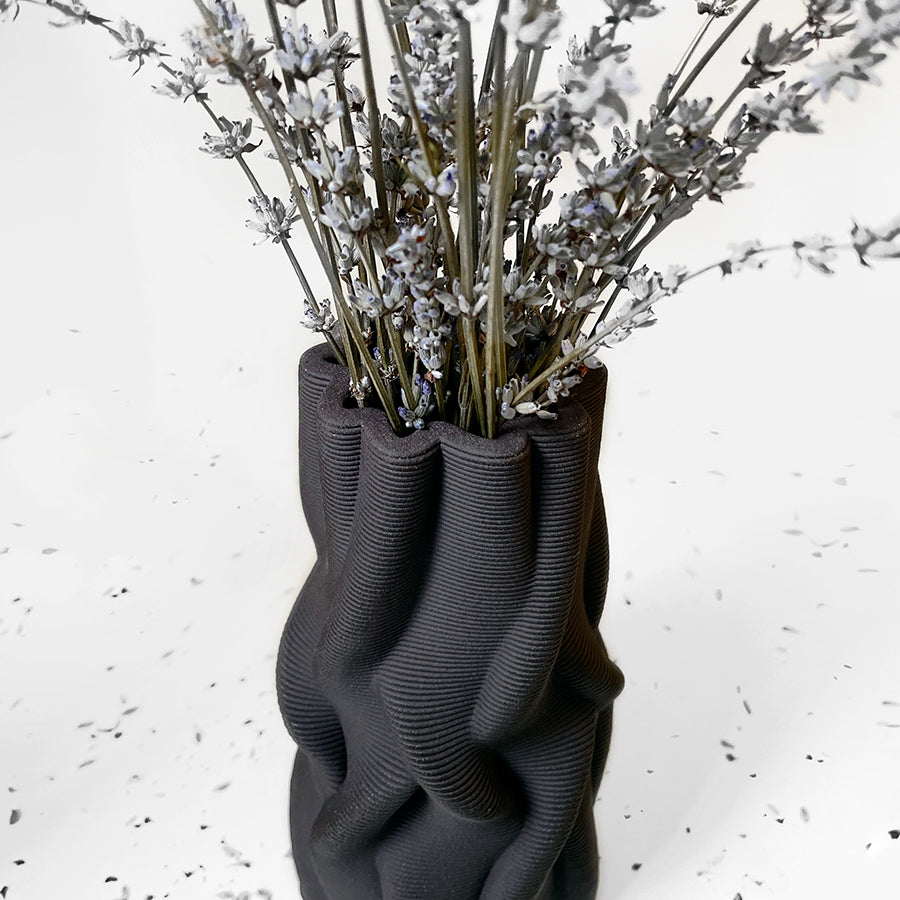 The award-winning Intertwined vase is inspired by the mesmerizing fluidity of growth patterns found in plant roots and tree trunks.