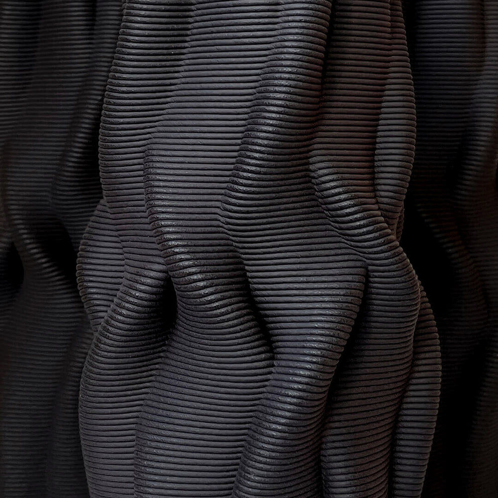 Notably, "Intertwined" has been recognized as a Green Product Award winner, a testament to its commitment to sustainability. The use of 3D printing technology minimizes material waste, while the choice of natural clay and the hand-finishing process further emphasize the eco-friendly nature of this exceptional vase.