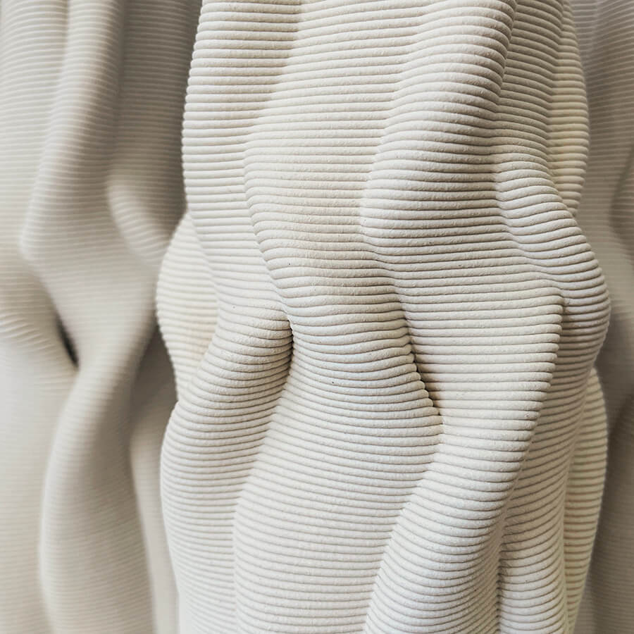 
                  
                    Through the fusion of cutting-edge technology, innovative design, and skilled craftsmanship, "Intertwined" pushes the boundaries of aesthetics and creativity. Utilizing advanced 3D printing techniques, this original design is meticulously brought to life using natural clay. Each layer is carefully deposited, guided by a digital blueprint that captures the essence of the intertwining patterns.
                  
                