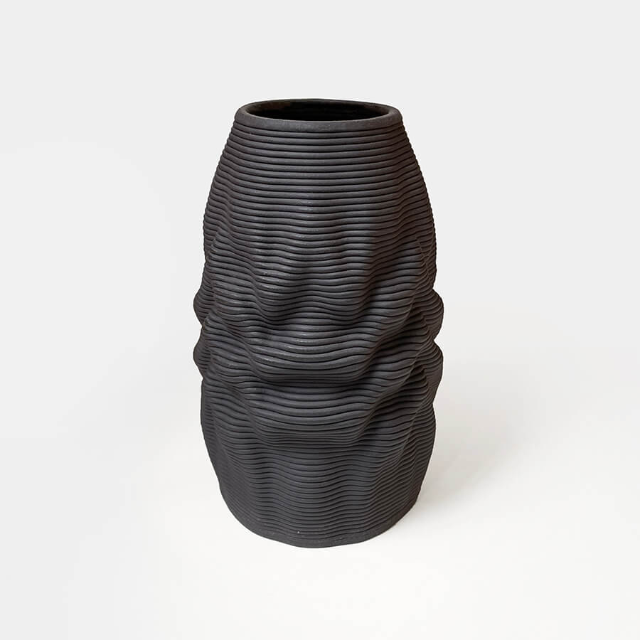 
                  
                    Introducing the Melting Vase, a unique fusion of art, technology, and craftsmanship. This exceptional vase draws its inspiration from the clay material and 3d printing process itself, resulting in a design that captivates with its soft and melting appearance.
                  
                