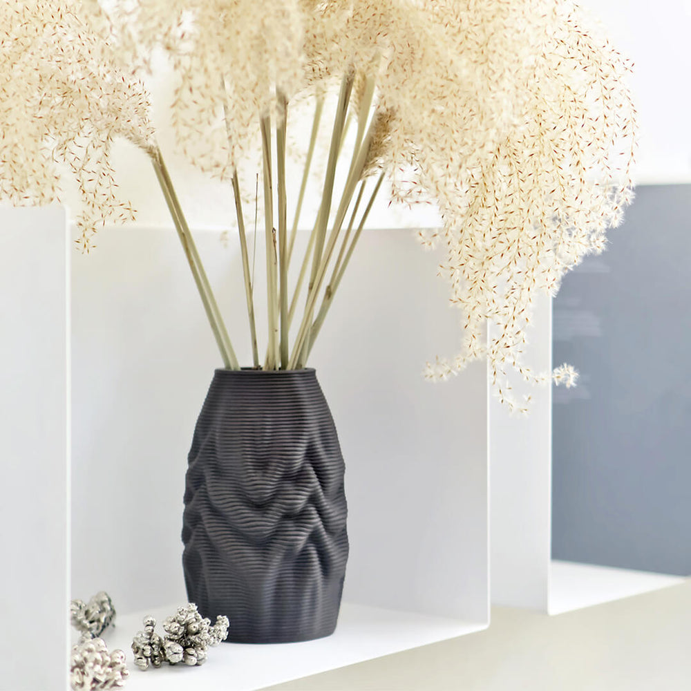 The ceramic 3d printed Melting Vase stands as a testament to the possibilities that arise when artistry and innovation converge. It serves as a captivating centerpiece, effortlessly merging the realms of design and craft, and making a bold statement in any space.