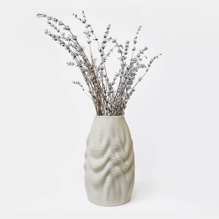 The essence of Melting Vase lies in its clever utilization of the malleable properties of wet clay during the 3D printing process. With each layer gently deposited, the clay embraces its soft nature, gradually forming a captivating shape that appears to be in a state of elegant dissolution.