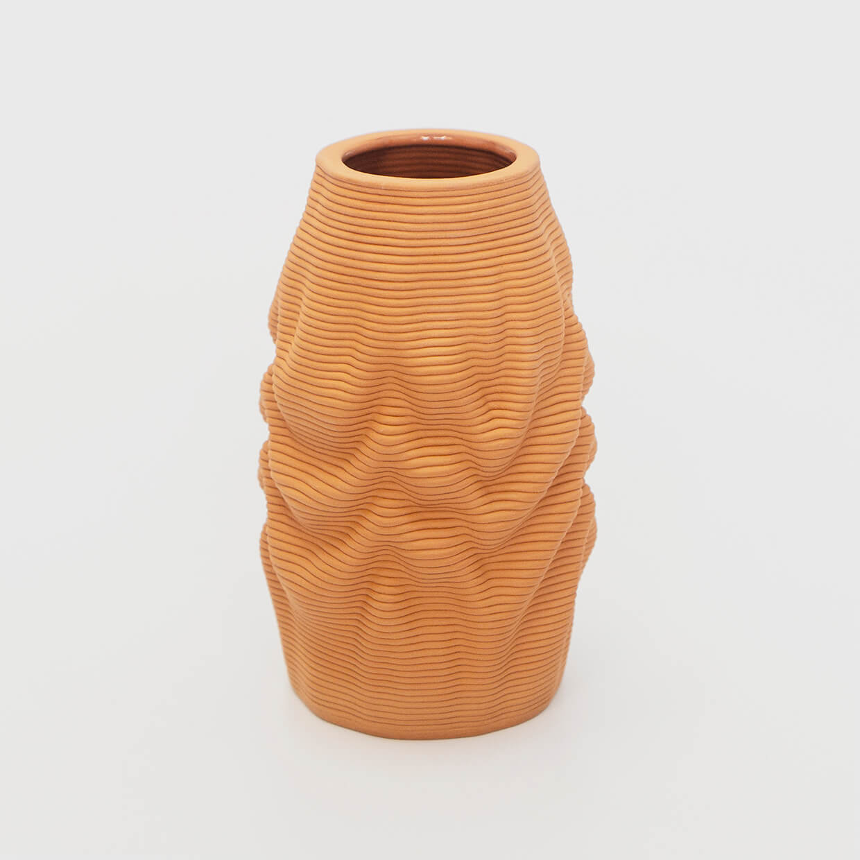 
                  
                    The tough stoneware body embodies the illusion of a soft, melting object, inviting viewers to contemplate the interplay between solidity and fluidity. The natural clay material exudes a warm and earthy aesthetic, further enhancing its organic appeal.
                  
                
