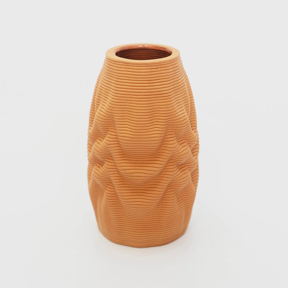 
                  
                    In this endeavor to explore new aesthetics, we seamlessly blend state-of-the-art technology with traditional craftsmanship. The Melting Vase is brought to life through advanced 3D printing techniques, where layers of natural clay are precisely and intricately added, guided by digital design. This innovative approach allows for the creation of intricate details and organic contours that would be challenging to achieve through traditional methods.
                  
                